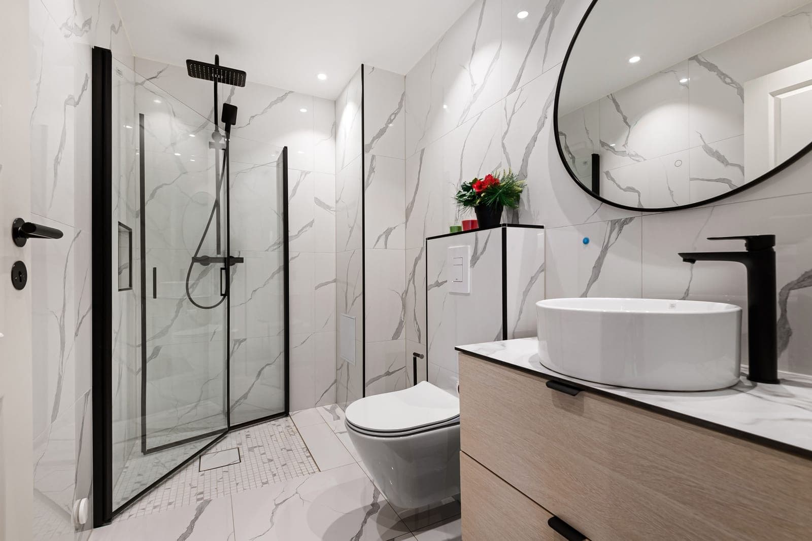 Two white toilets side by side in a bathroom showroom