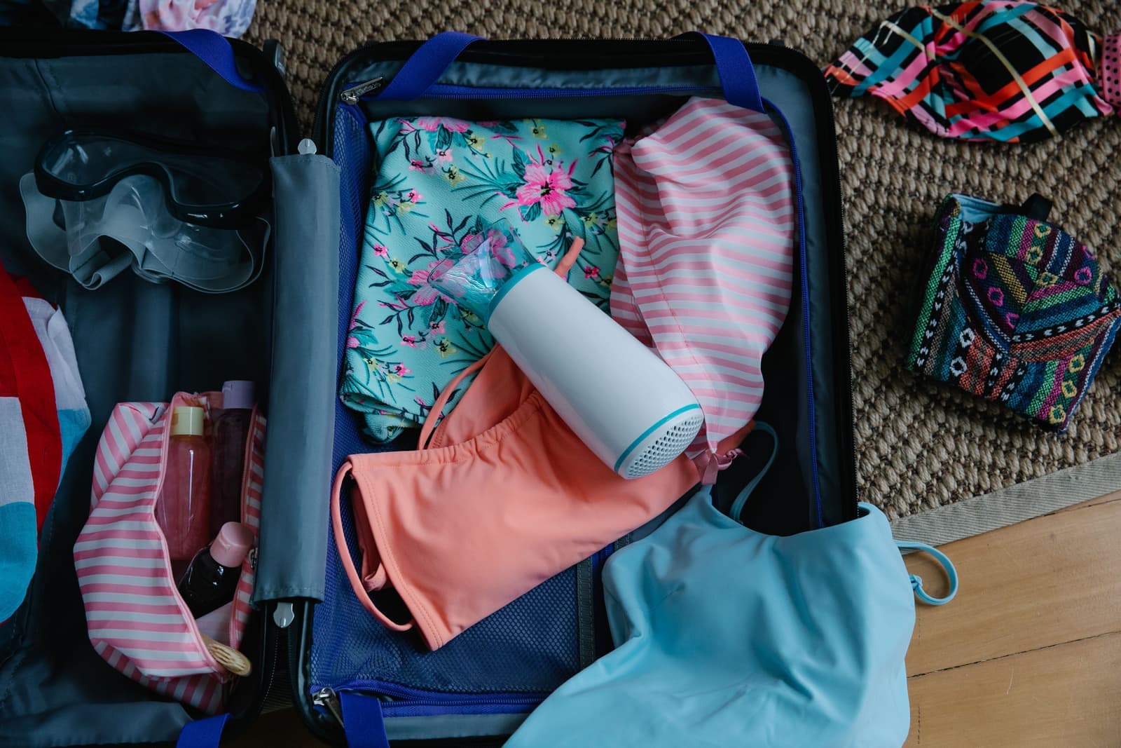 Travel toiletry bottles packed in a bag