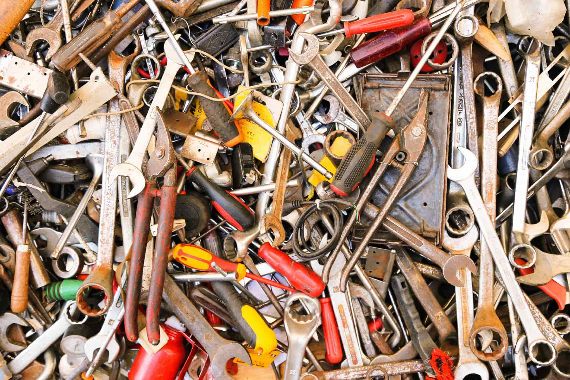 A screwdriver and fixing bolts on a surface