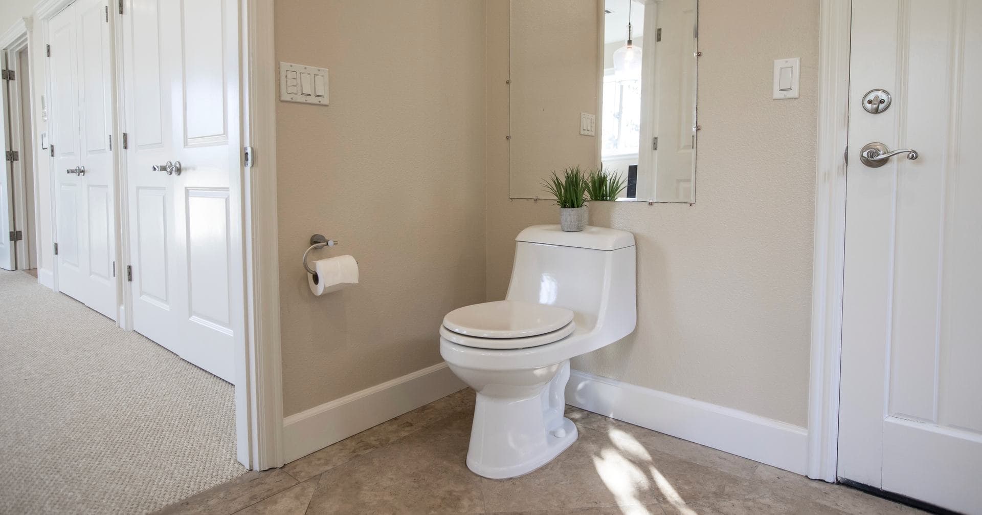 A minimal white bathroom with a toilet