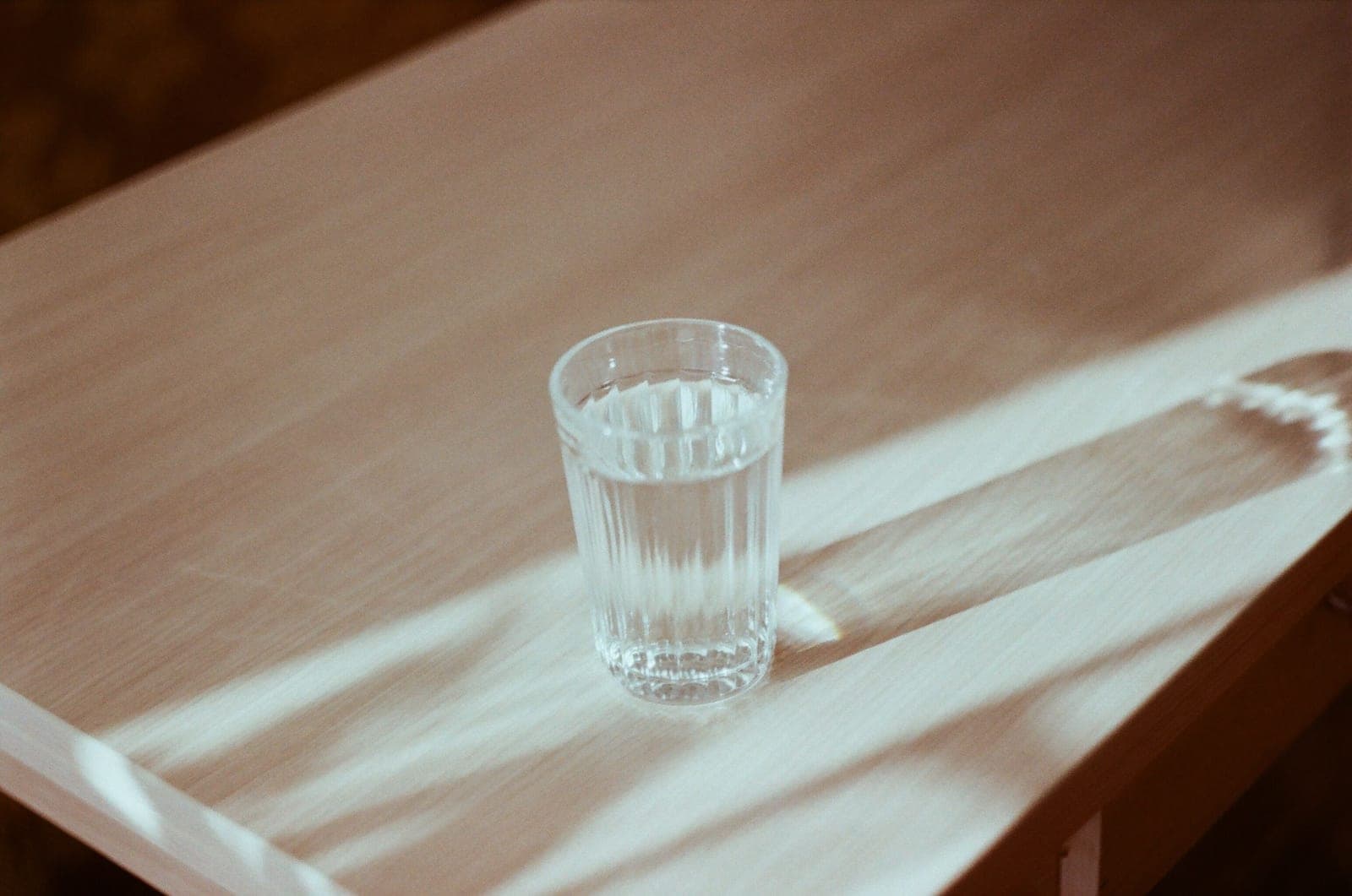 A glass of clear water in sunlight