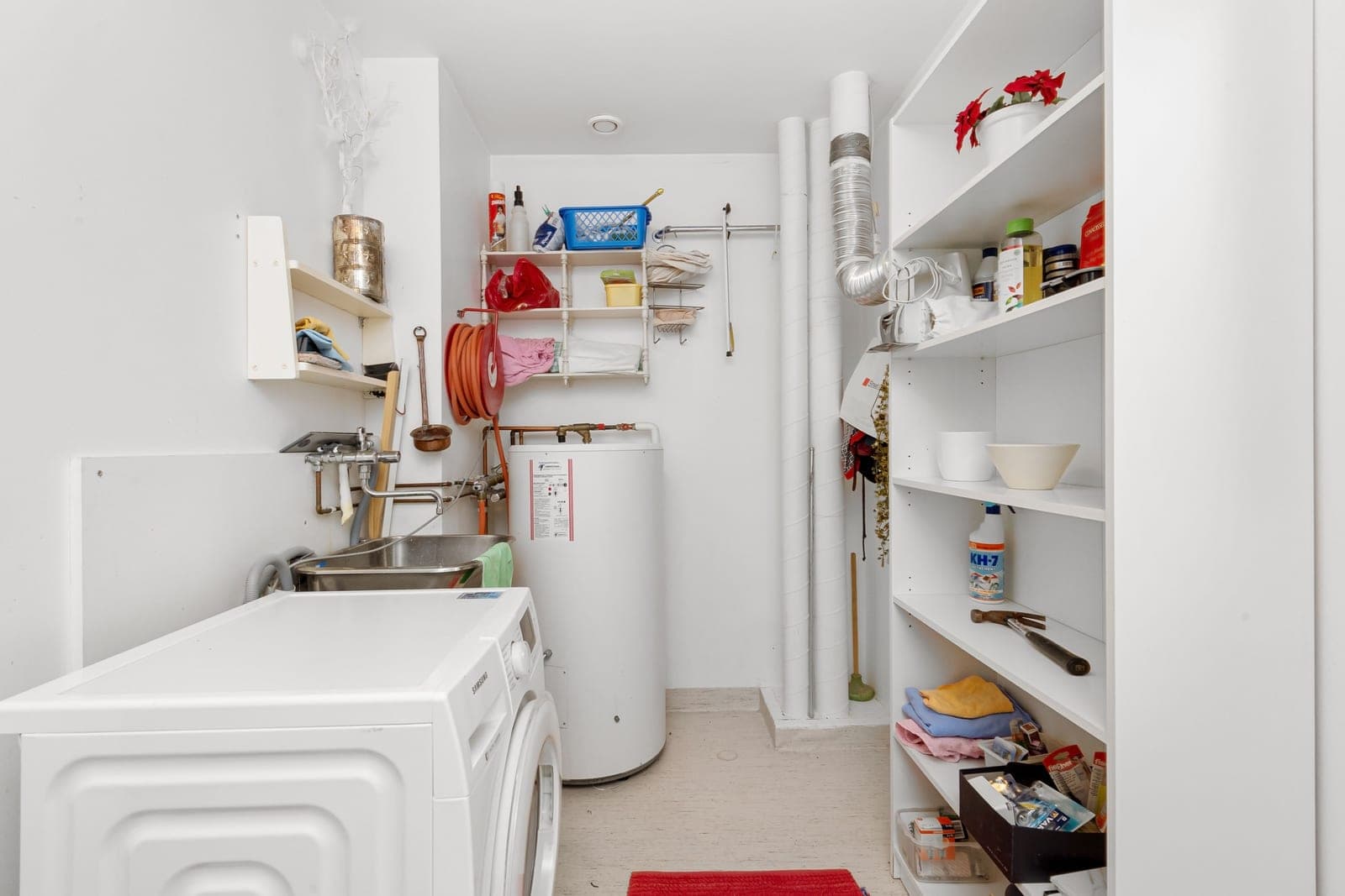 A water softener tank in a utility room