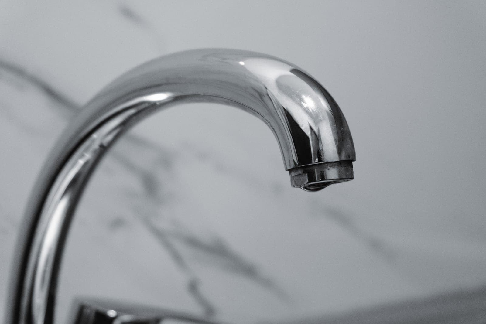 Limescale build-up on a chrome tap
