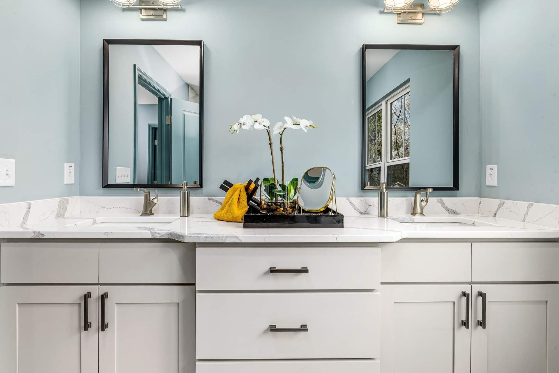 A bathroom vanity cabinet with a basin