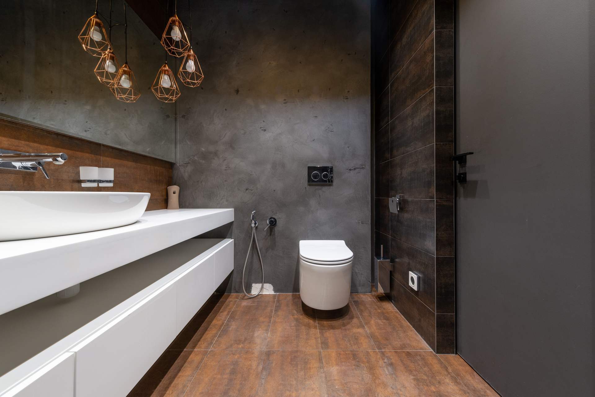A white toilet in a modern bathroom