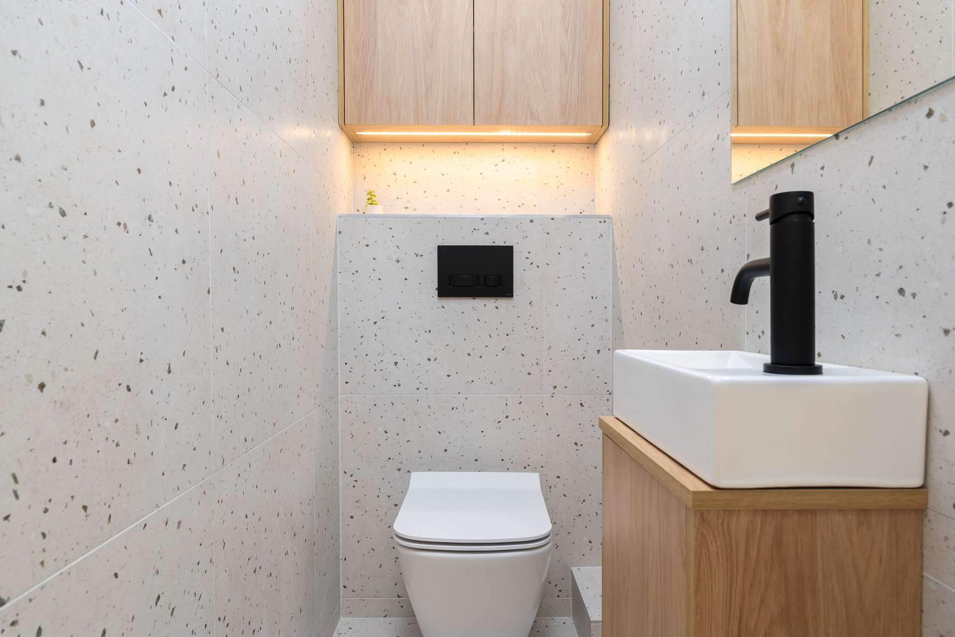 A compact toilet in a small bathroom