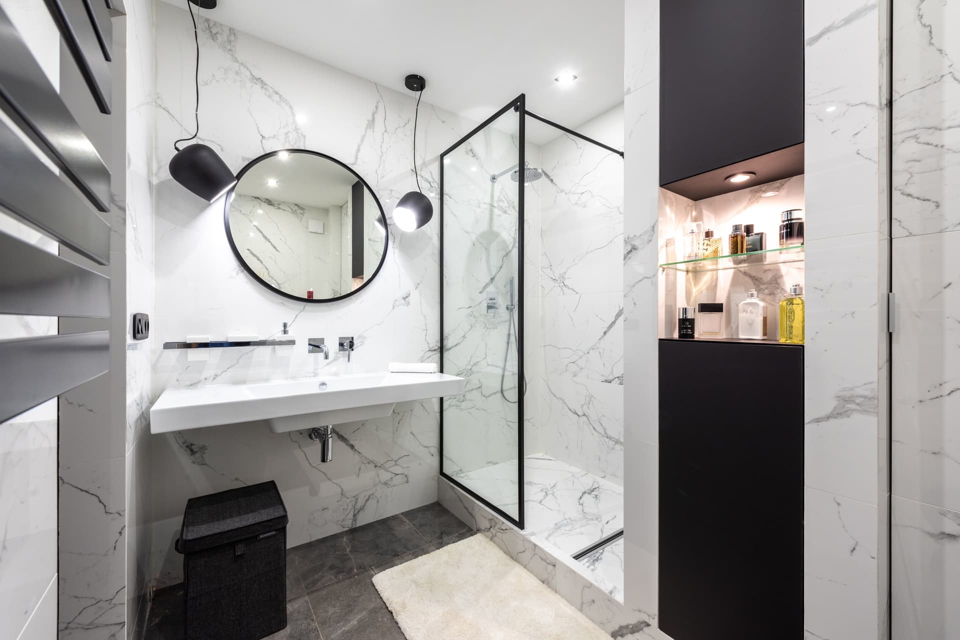 A metal shelf in a shower enclosure