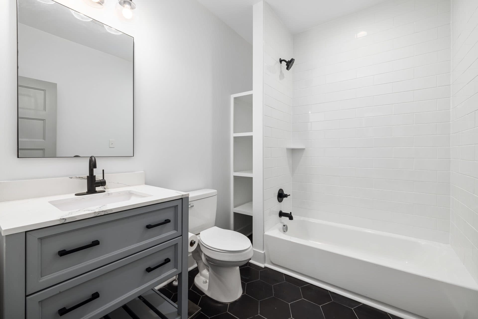 Shelving above a toilet in a small bathroom