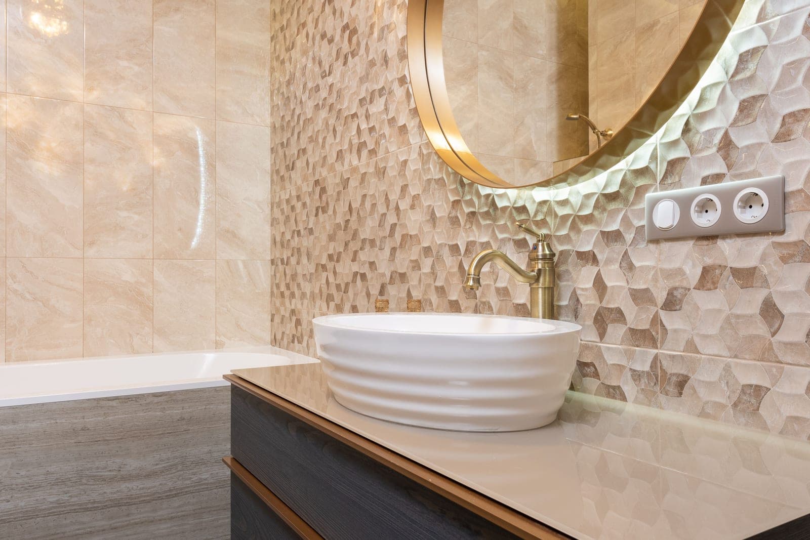 A bright bathroom mirror above a basin in daylight
