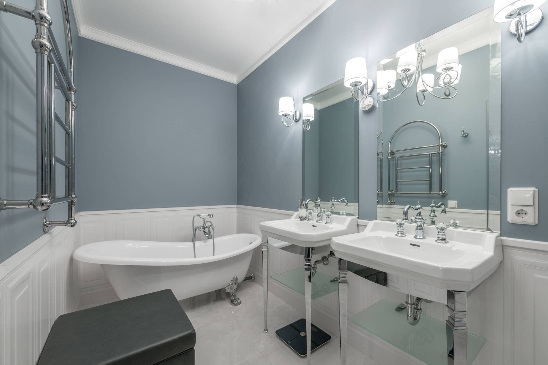 Wall lights beside a bathroom mirror