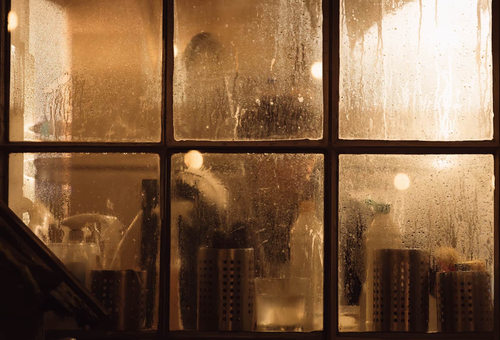 A fogged bathroom mirror covered in condensation