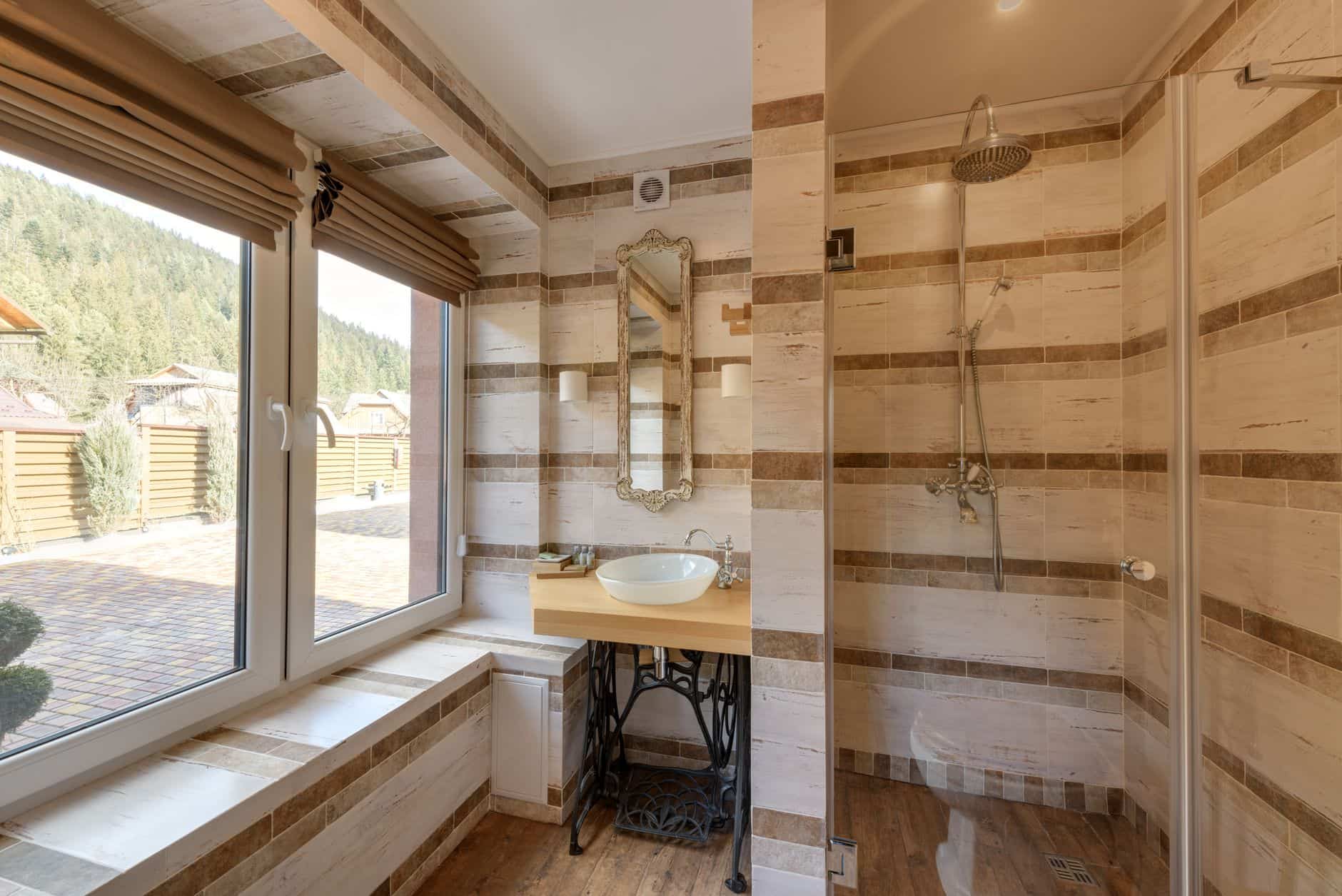 An open bathroom window beside a shower