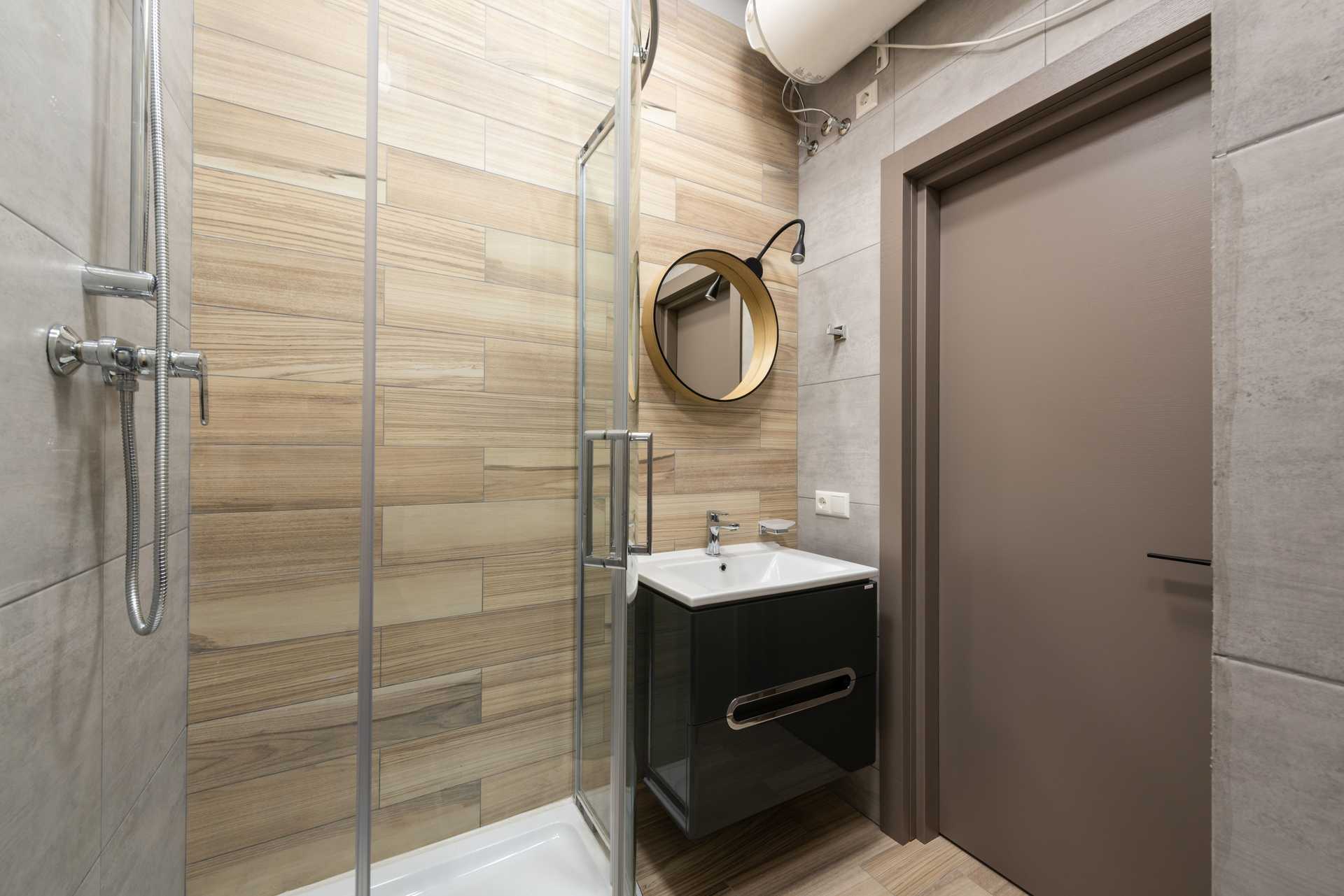 A compact shower in a small apartment bathroom