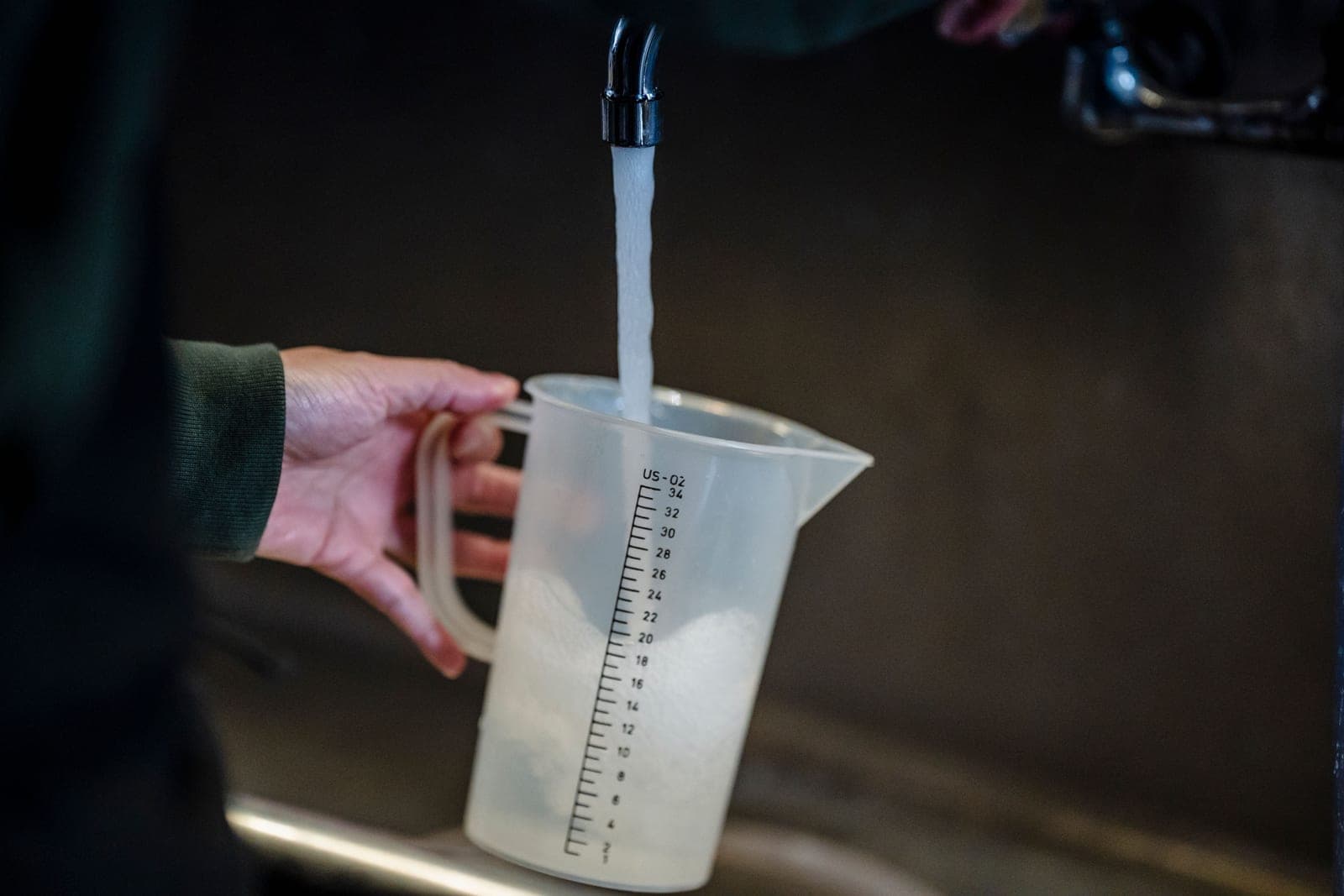Water flowing into a measuring jug