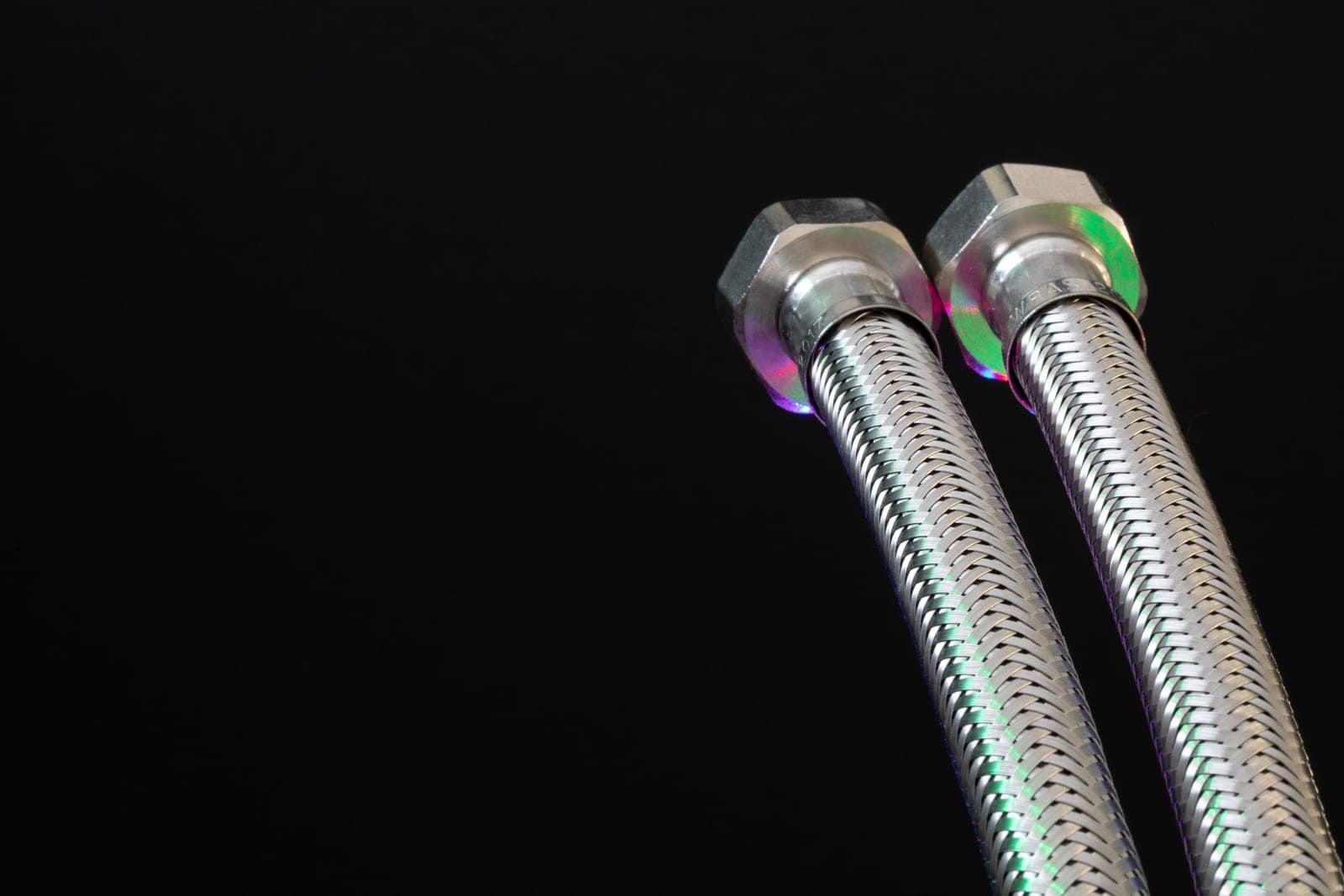 A flexible metal shower hose photographed close up