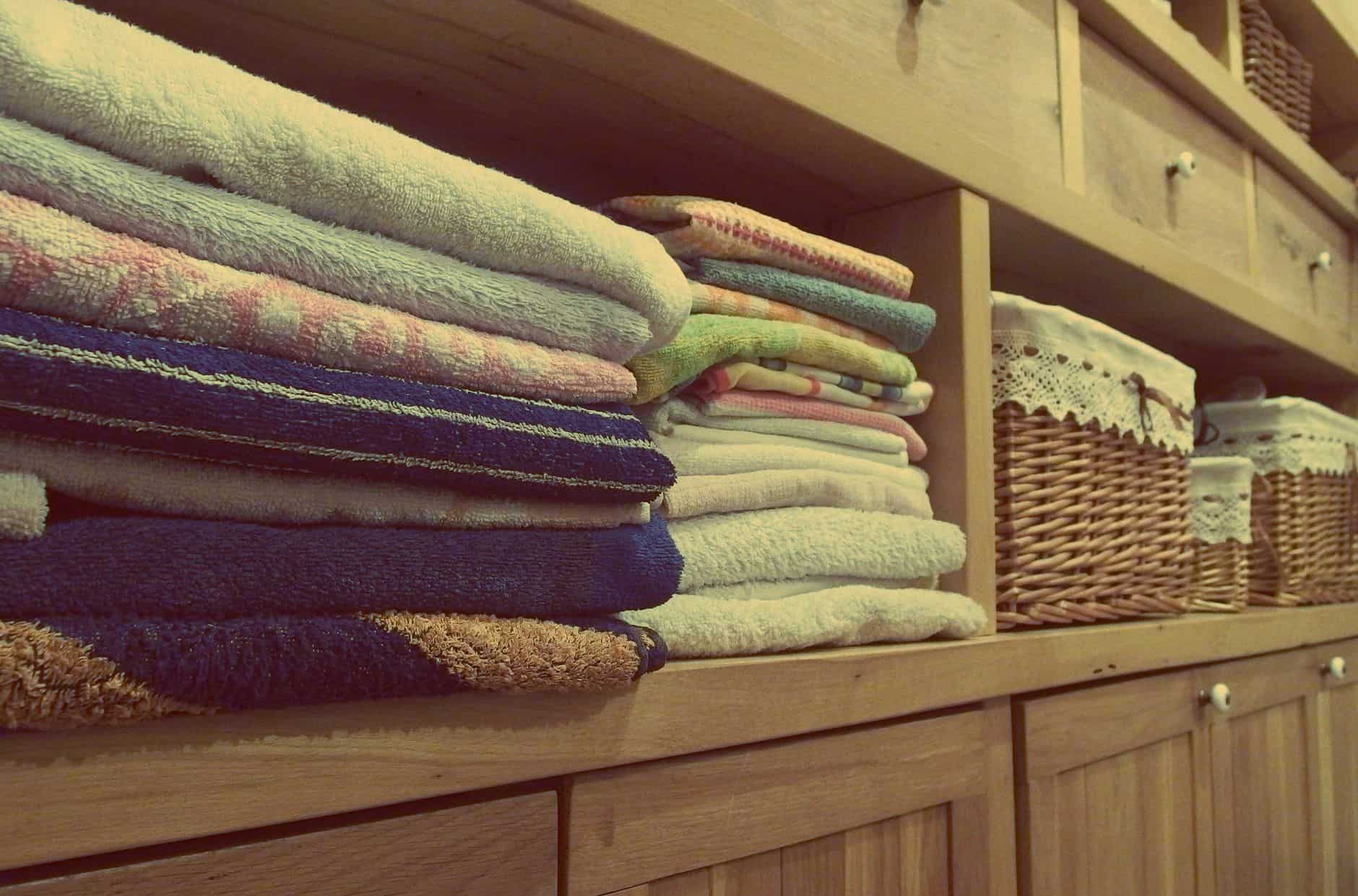 Folded bath towels on a shelf